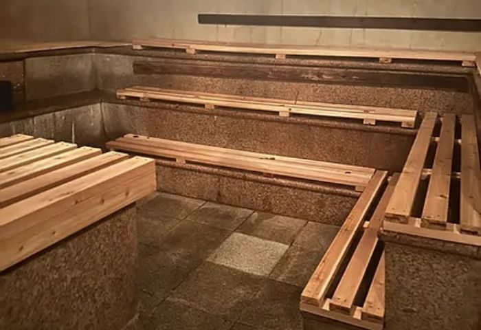 Russian and Turkish Baths in New York: Interior view of wooden benches in the bathhouse. A popular destination for gay men's travel.