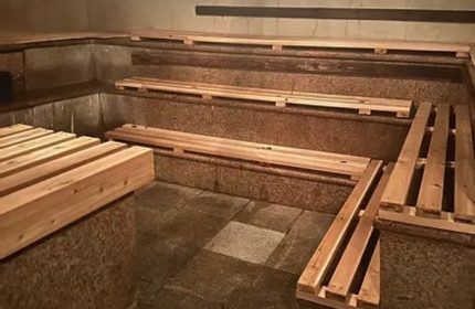 Russian and Turkish Baths in New York: Interior view of wooden benches in the bathhouse. A popular destination for gay men's travel.