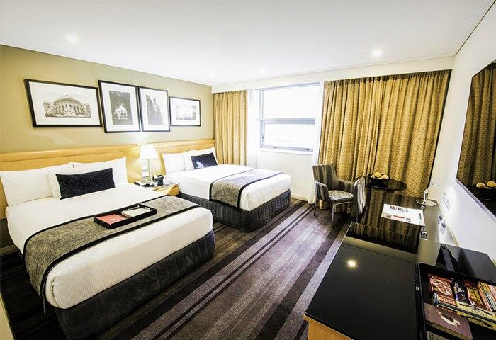 Rydges World Square Sydney hotel room. Two beds, modern decor. City center hotel near gay bars. Gay travel lodging. Comfy hotel.