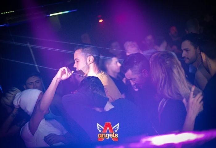 Madrid gay club scene: Men dancing at Sala Republik Club, a popular gay club in Madrid, Spain. Nightlife, travel advice.