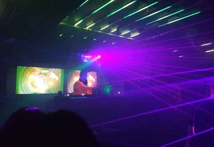 Madrid Gay Club Sala Republik: DJ with lasers, screens, and lights. A popular gay nightlife spot for gay men visiting Madrid.