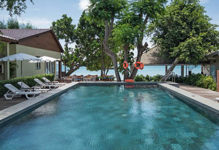 Samed Club Resort: Cute beachfront gay hotel with pool. Poolside loungers, ocean view, life preservers. Relaxing gay travel destination.