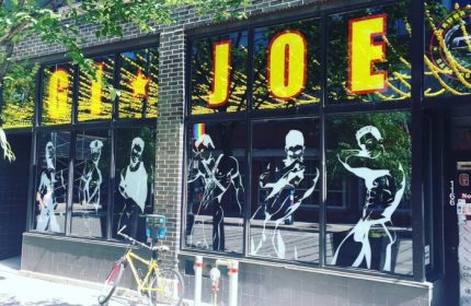 Sauna G.I. Joe in Montreal. Exterior view of the gay bathhouse, with window displays of muscular men. Gay travel advice.