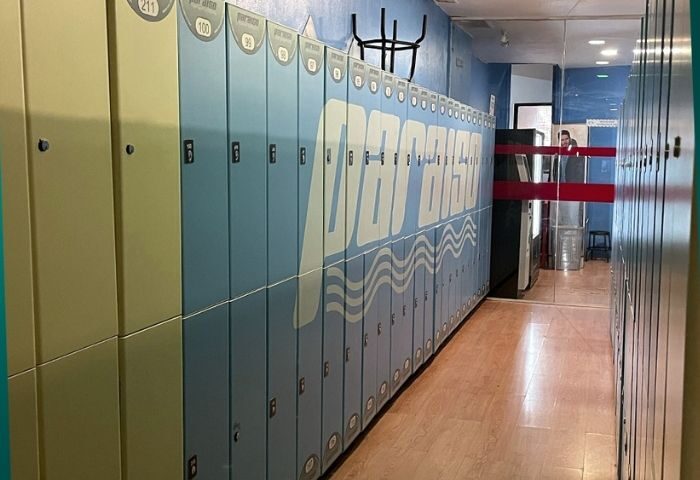 Lockers at Paraiso, a gay sauna in Madrid. The lockers are blue and white, with the name of the sauna on them. Gay travel advice.