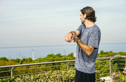 Gay man stretching at Shalom Hotel & Relax, an Atlas Boutique Hotel in Tel Aviv. Most booked gay hotel. Sea view.
