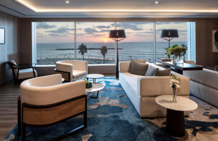 Sheraton Tel Aviv Hotel lounge area. Luxury gay hotel near gay bars and saunas in Tel Aviv. Beach view at sunset.