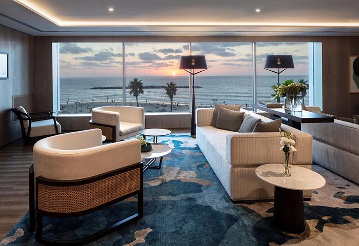 Sheraton Tel Aviv Hotel lounge area. Luxury gay hotel near gay bars and saunas in Tel Aviv. Beach view at sunset.