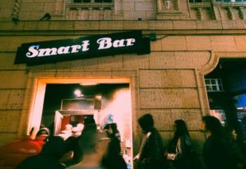 Smartbar entrance at a gay party in Chicago. People are queuing to enter the bar. Nightlife scene, gay travel advice.