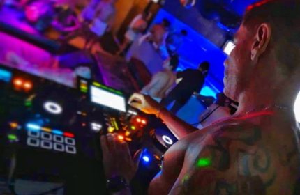 Sodome Bath House: DJ at gay bathhouse, mixing music for the crowd. Nightlife scene with men. Sodome-Bath-House-2.jpg. Gay travel advice.