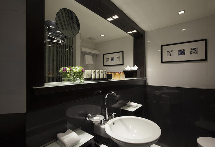 Luxury bathroom at Sofitel Lisbon Liberdade, a popular gay-friendly hotel. Features modern design, sleek fixtures, and upscale amenities.