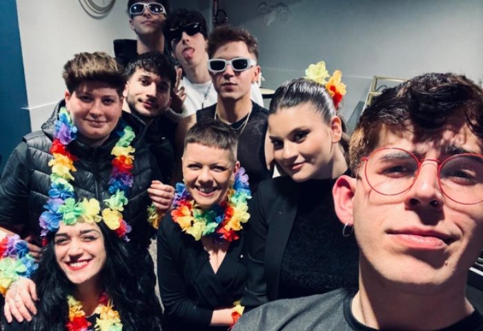 Spiritall Lounge Bar Rome group photo. People wear rainbow leis, sunglasses. Gay travel advice, Rome nightlife.