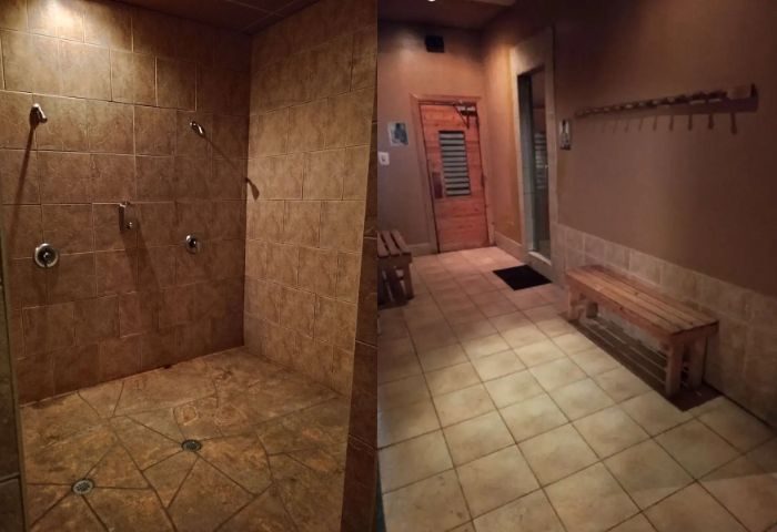 Splash Steam and Sauna gay cruising in Toronto: tiled shower area with multiple shower heads, sauna entrance, and bench in a warm-toned room.