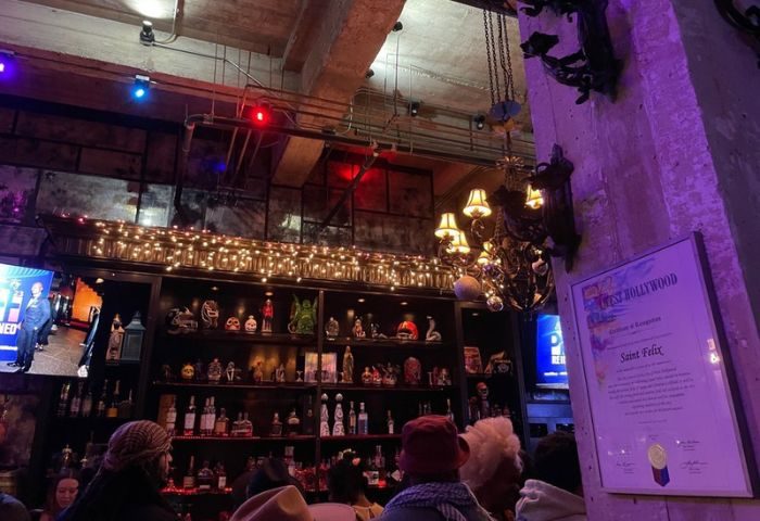 St Felix Hollywood night life. Interior of the gay bar in West Hollywood, CA. Shelves of curios, bottles, and patrons at the bar.