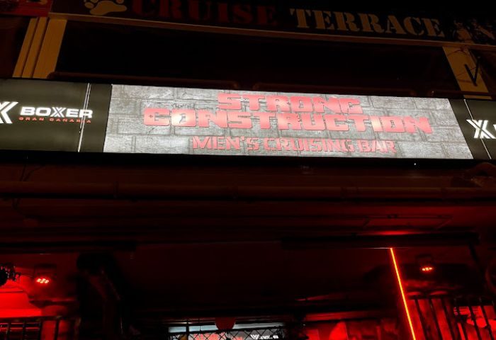 Strong Construction gay cruise club in Gran Canaria. Men's cruising bar sign. Gay travel advice for gay men.