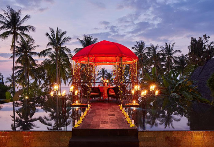 Romantic dinner setup at Kupu Kupu Phangan Beach Villas & Spa by L’Occitane. Gay-friendly luxury hotel in Koh Phangan, Thailand.