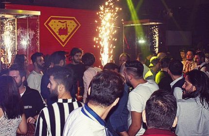 SuperFabric Club Istanbul crowd. Gay men enjoy the night with sparks and lights. Nightlife scene for gay travelers.
