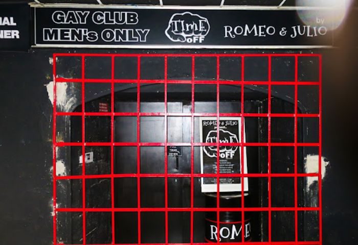 Time Off Romeo & Julio gay cruise club in Gran Canaria. Men's only sign above a barred door. Gay travel advice.