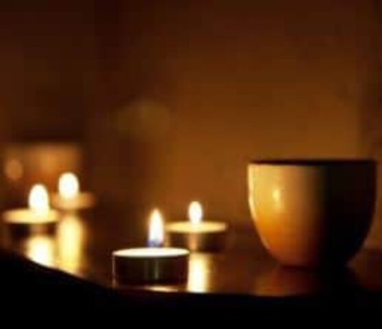 Candles and a bowl create a relaxing atmosphere. Gay massage spa in London. Tantric Soul Gay Massage London.