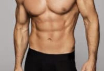 Torso of muscular man for Tantric Soul Gay Massage London gay massage spa. Male physique, abs, and arms.