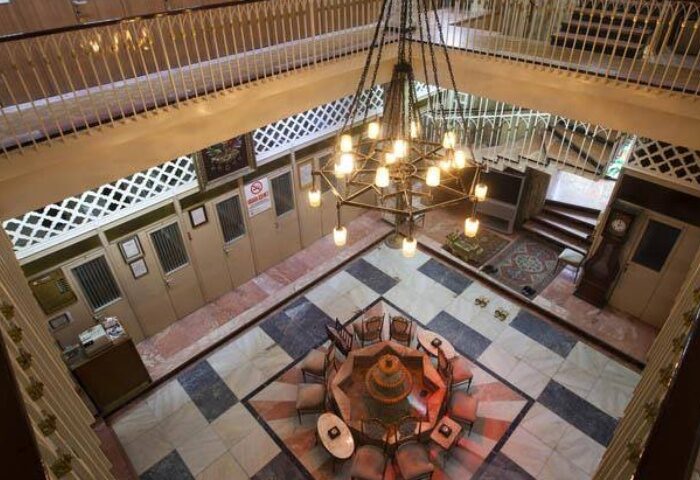 Galatasaray Hamami interior, Istanbul. Ottoman-era bathhouse with a central fountain, chandelier, and marble floors. A gay travel destination.