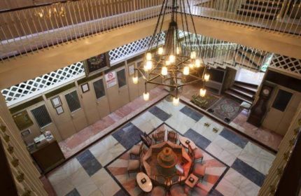 Galatasaray Hamami interior, Istanbul. Ottoman-era bathhouse with a central fountain, chandelier, and marble floors. A gay travel destination.