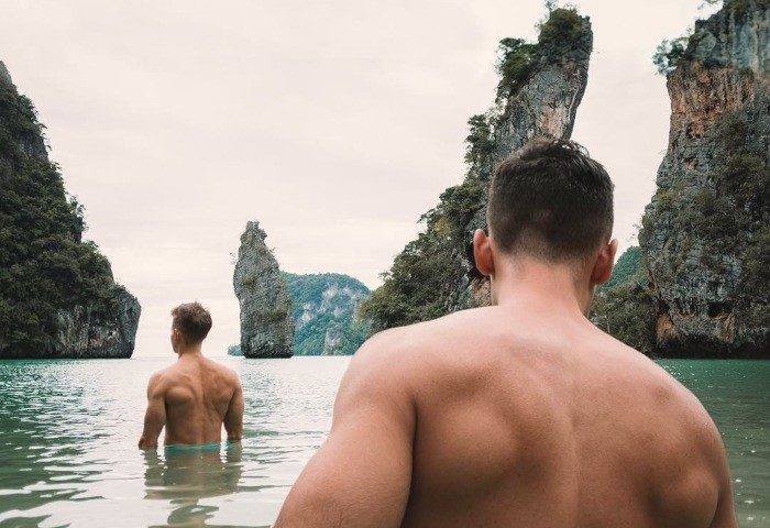 Two gay men in Khao Lak, Thailand. Phuket's SIS Kata gay-friendly hotel offers amazing views. Andrew Scott would approve!