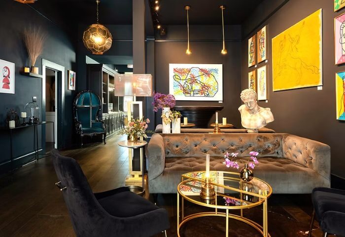 The Academy Social Club in San Francisco: Stylish interior with velvet seating, art, and elegant decor. A gay-friendly travel destination.