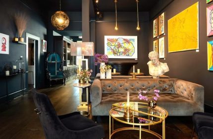 The Academy Social Club in San Francisco: Stylish interior with velvet seating, art, and elegant decor. A gay-friendly travel destination.