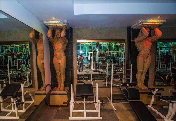 Babylon Bangkok Hotel gym with male statues and fitness equipment. Best gay hotel and gay sauna in Bangkok.