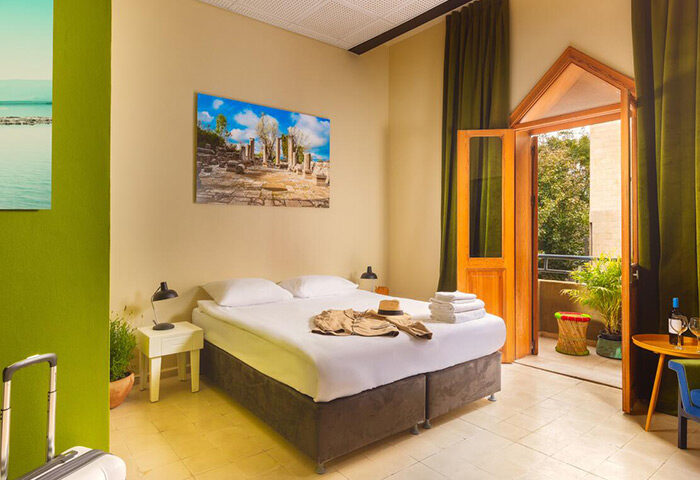 Inta Hotel, Tel Aviv-Jaffa. Adults-only gay hotel room with balcony. Modern decor, double bed, and travel accessories. Best gay hotel.