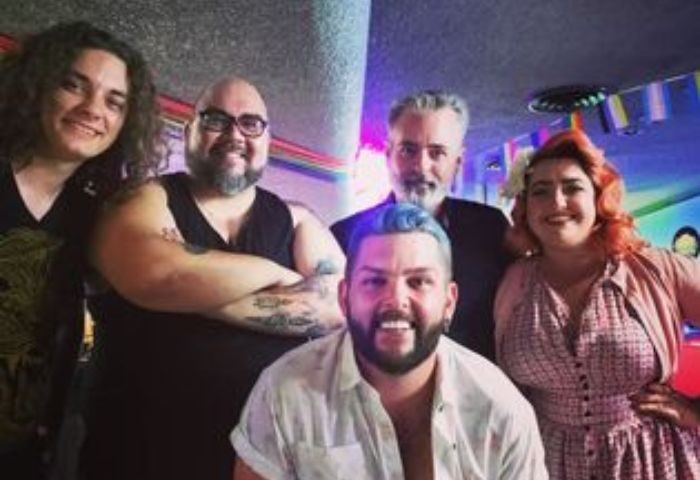 Group at The Broadway Bar, a gay karaoke bar. Rainbow flags hang above. The-Broadway-Bar-Karaoke.jpg. Gay men travel advice.