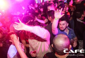 The Cafe Night Club in San Francisco. A packed gay bar with men dancing under pink lights. Nightlife advice for gay men in San Francisco.