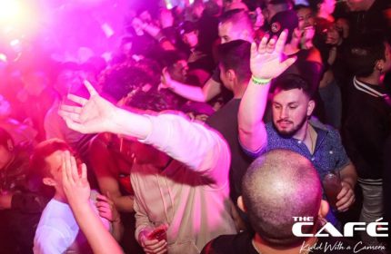 The Cafe Night Club in San Francisco. A packed gay bar with men dancing under pink lights. Nightlife advice for gay men in San Francisco.