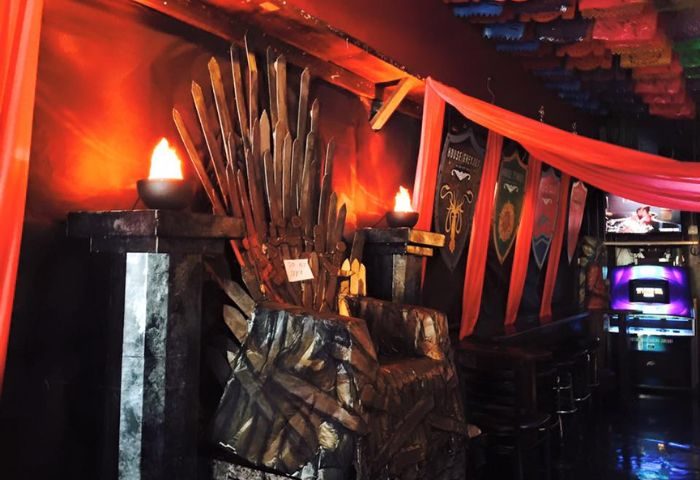 The Cinch Saloon in San Francisco: Game of Thrones-themed decor with a sword throne, banners, and torches. A popular gay bar for travel advice.