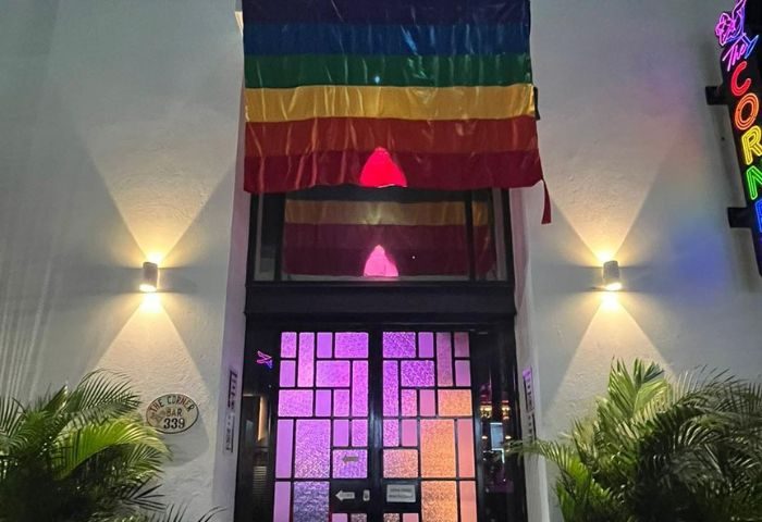 The Corner Bar, a gay-friendly place with music in Puerto Vallarta. Rainbow flag above the entrance. Nightlife destination.