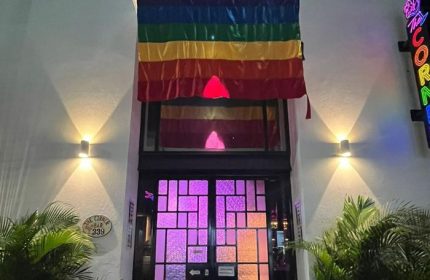 The Corner Bar, a gay-friendly place with music in Puerto Vallarta. Rainbow flag above the entrance. Nightlife destination.