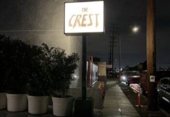 The Crest Long Beach sign at night. A gay bar known for its friendly atmosphere and strong drinks in Long Beach, CA. Gay travel guide.
