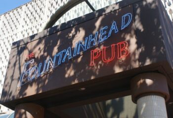 The Fountainhead Pub in Vancouver. Neon sign of a popular gay-friendly bar. Vancouver's nightlife for gay men travel advice.