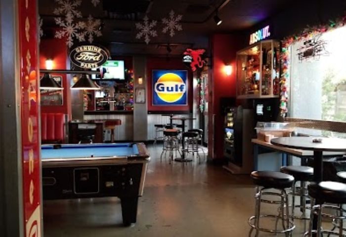 The Garage Bar in Las Vegas, a gay travel destination. Pool table, bar stools, and automotive decor create a unique, fun atmosphere.