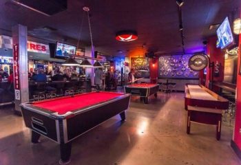 The Garage Bar in Las Vegas. Interior shot of the gay bar with pool tables, shuffleboard, TVs, and a lively atmosphere for gay men.