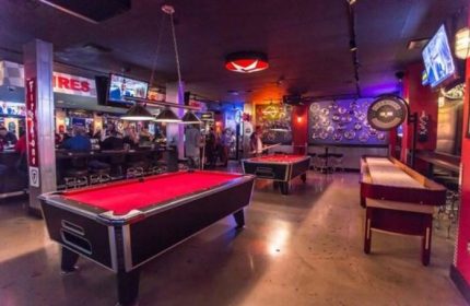 The Garage Bar in Las Vegas. Interior shot of the gay bar with pool tables, shuffleboard, TVs, and a lively atmosphere for gay men.