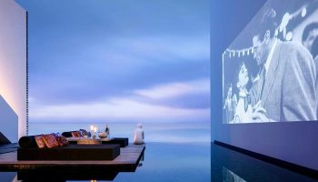 The Library Hotel Koh Samui: Cool design, Instagram-worthy gay hotel. Infinity pool with movie screen, ocean view, and chill lounge area.