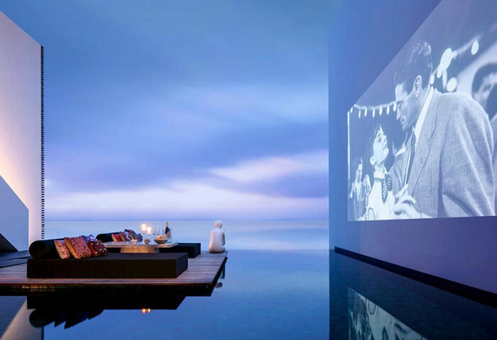 The Library Hotel Koh Samui: Cool design, Instagram-worthy gay hotel. Infinity pool with movie screen, ocean view, and chill lounge area.