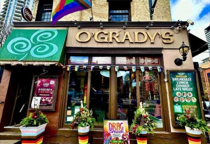 O'Grady's, a gay-friendly lodge in Toronto, Canada. Rainbow flags adorn the entrance. The Lodge at O'Gradys is a popular gay bar.