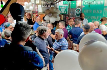 Lone Star Saloon: Gay men gather at a popular bar in San Francisco. The bar is decorated with balloons and vintage signs.