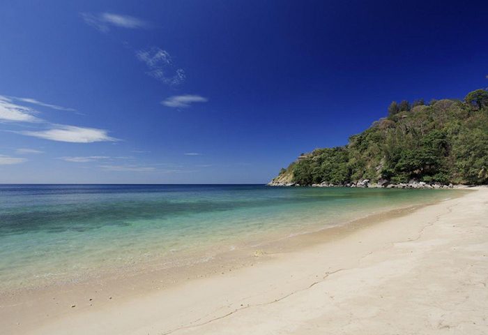The Naka Phuket Villa private beach. Gay hotels Phuket this year update. Tropical beach, clear water, blue sky. Gay travel.