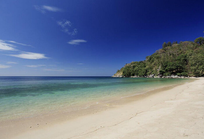 The Naka Phuket Villa private beach. Gay hotels Phuket this year update. Tropical beach, clear water, blue sky. Gay travel.