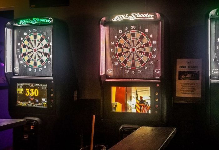 Chicago's North End gay sports bar: electronic dart boards. Bull Shooter game with digital display, a fun activity for gay travelers.