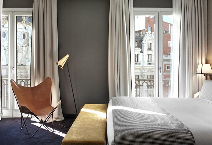 Luxury room at The Principal Madrid Hotel, a top gay-friendly hotel in Madrid's city center, near the gayborhood. Modern design, balcony view.
