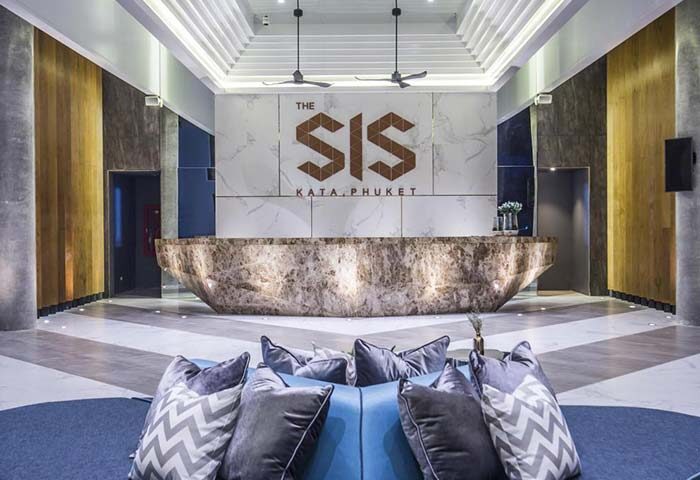 The SIS Kata Resort lobby in Phuket. Modern design with marble reception desk. Gay-friendly hotel for gay men travel. Interior of The SIS Kata.